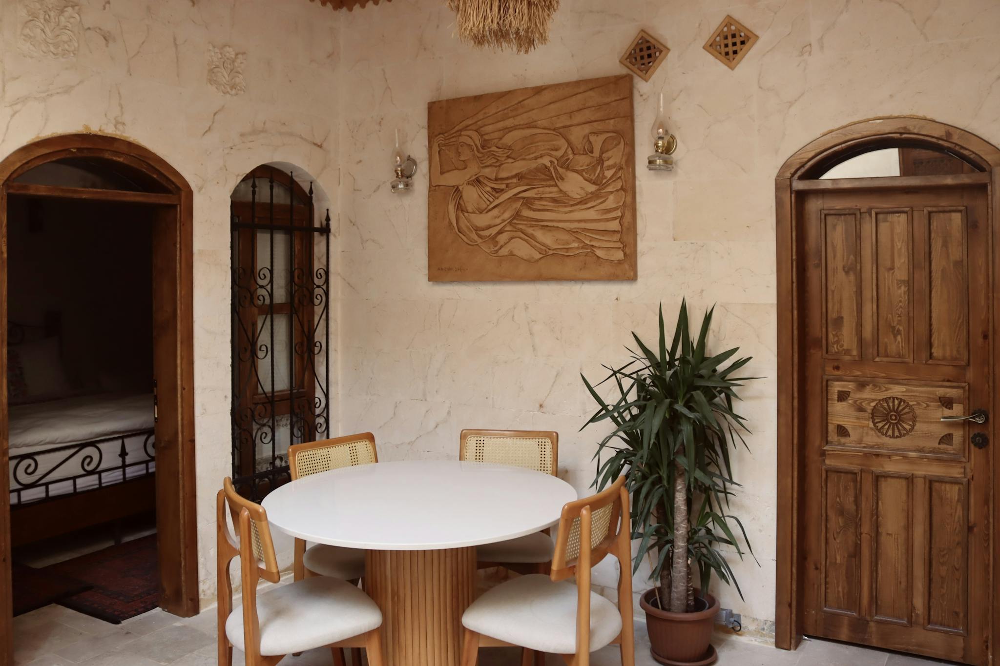 Rustic hotel interior with wooden tones and artistic decor in Şanlıurfa, Türkiye.